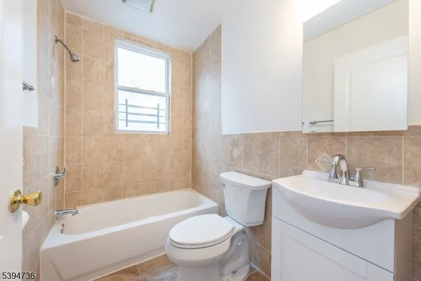 a bathroom with a sink toilet and bathtub