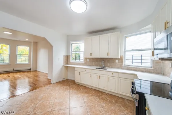 a large bathroom with a sink and a bathtub