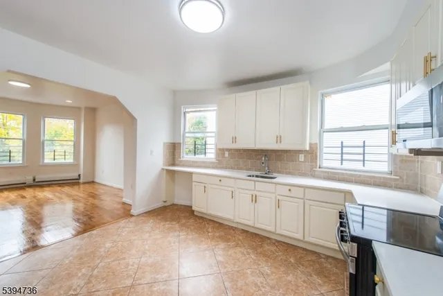 a large bathroom with a sink and a bathtub