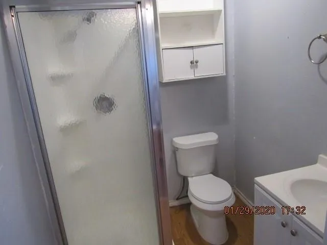 a white toilet sitting next to a bathroom sink