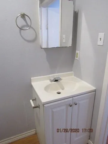 a bathroom with a sink and mirror