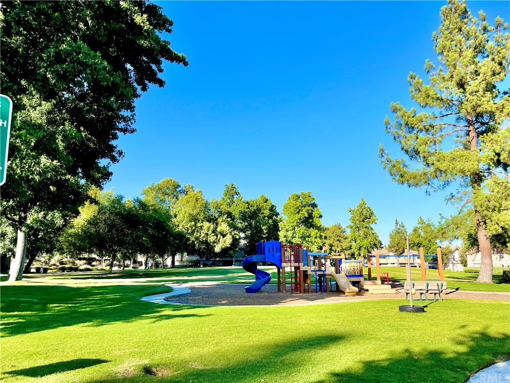 8328 Spring Desert Place, Unit H Rancho Cucamonga, CA 91730 - Photo 1 of 1 a view of a park with large trees