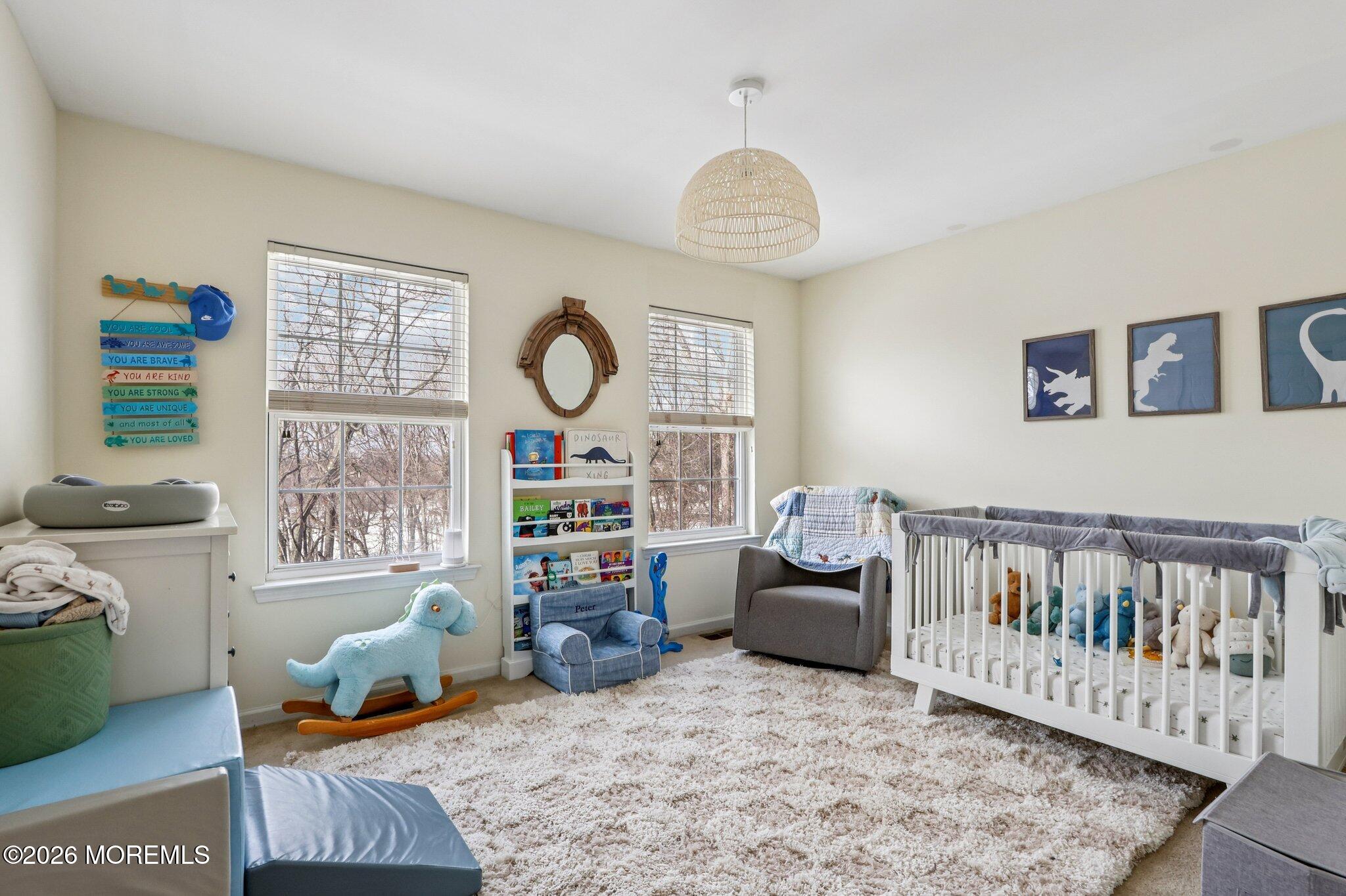 14 West Aspen Way Matawan, NJ 07747 - Photo 18 of 46 a bedroom with furniture and a window