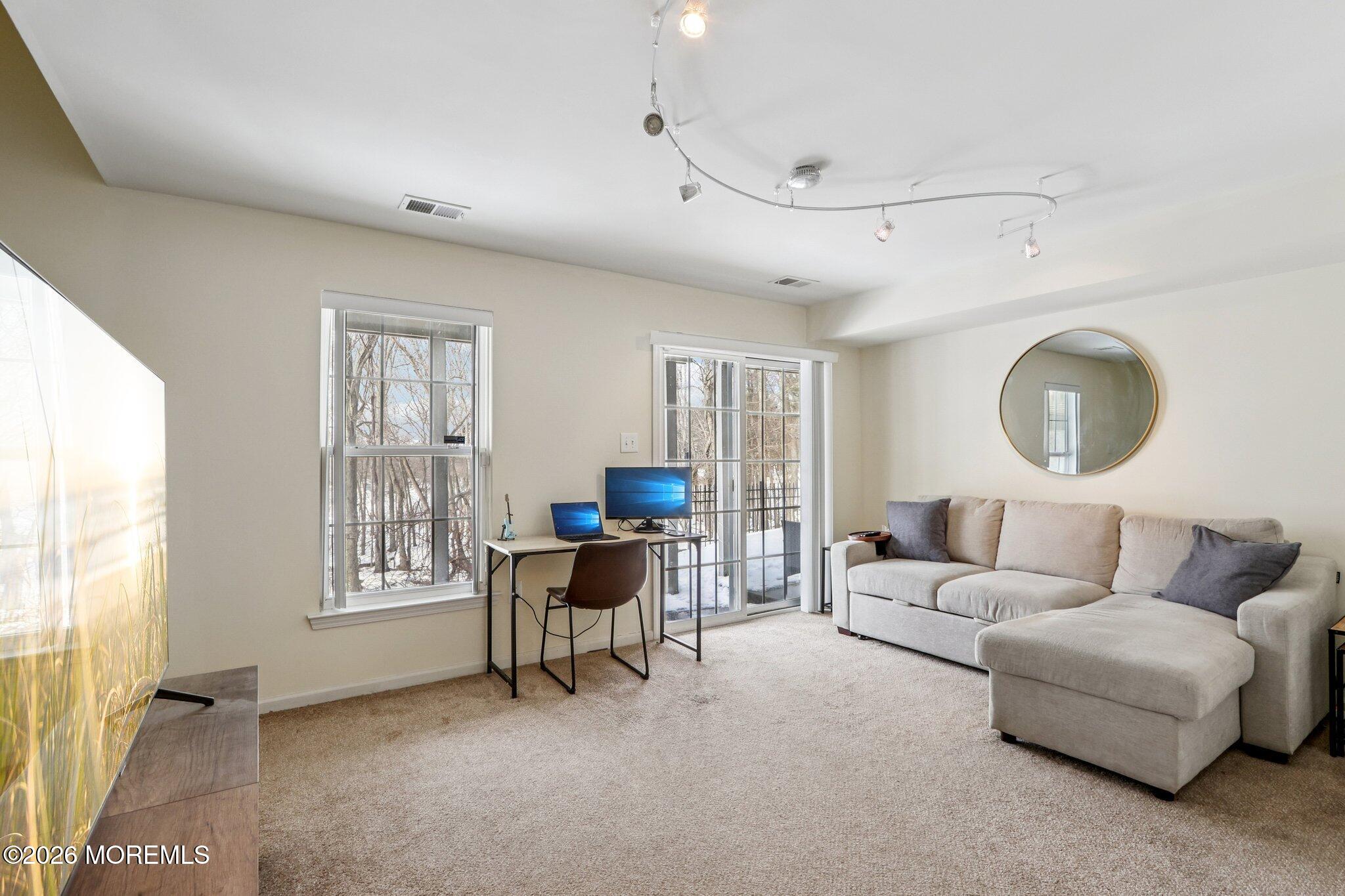 14 West Aspen Way Matawan, NJ 07747 - Photo 22 of 46 a living room with furniture and a window