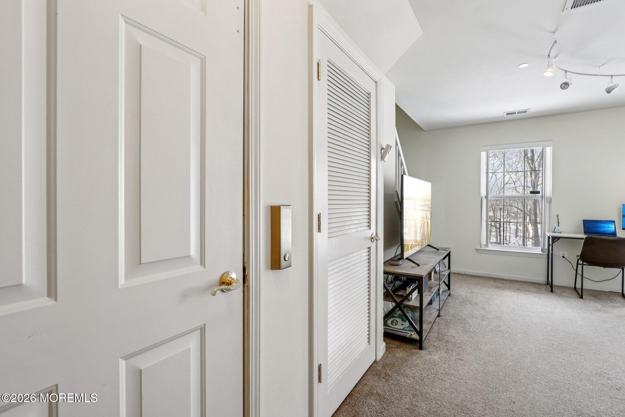 14 West Aspen Way Matawan, NJ 07747 - Photo 25 of 46 a view of a workspace with furniture and a window