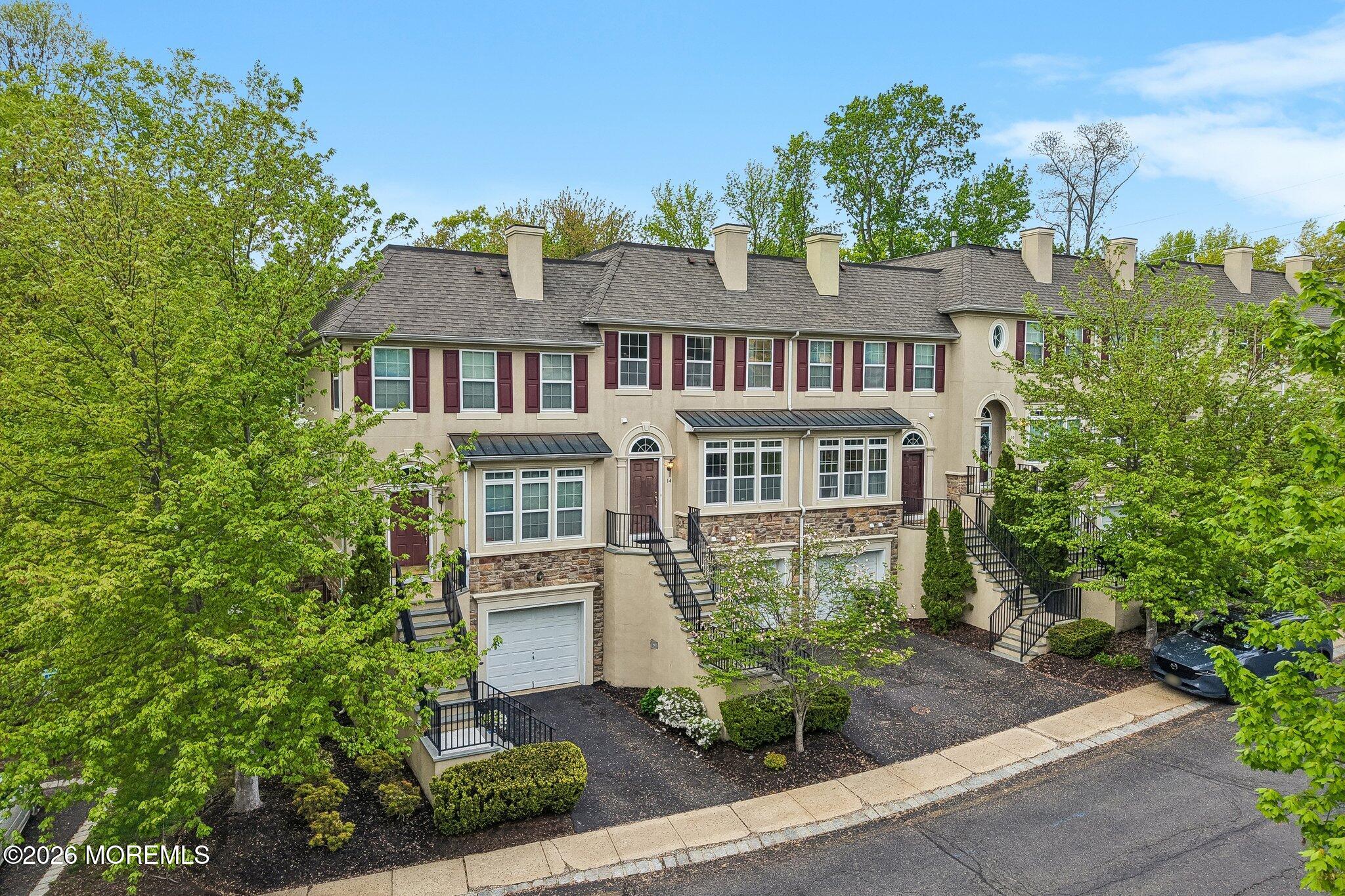 14 West Aspen Way Matawan, NJ 07747 - Photo 31 of 46 front view of a house with a garden