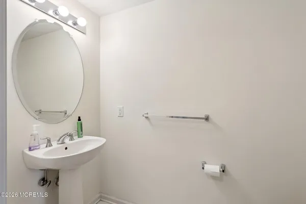 a view of roof with a bench and trees