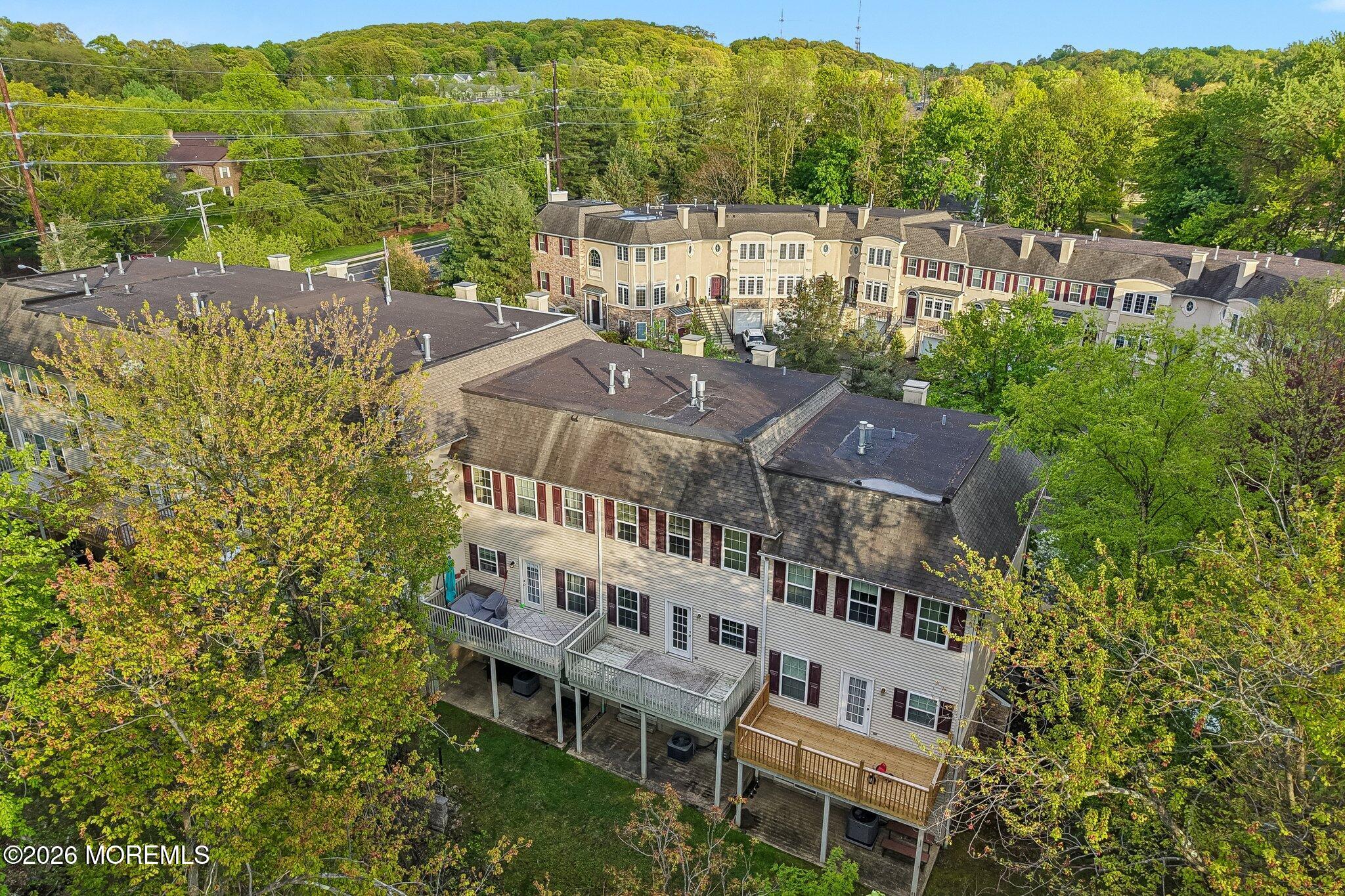 14 West Aspen Way Matawan, NJ 07747 - Photo 34 of 46 a view of a city with tall buildings