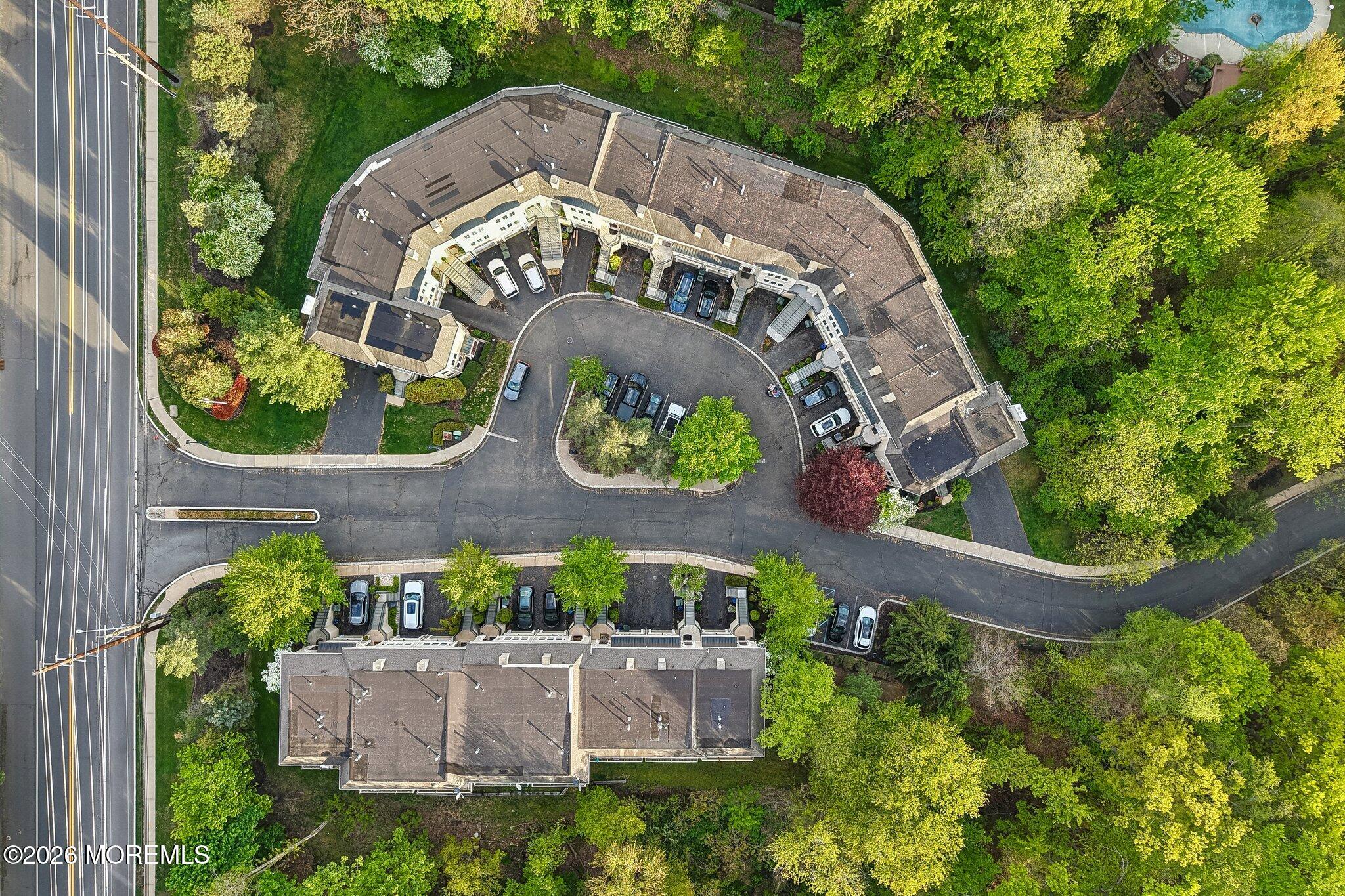 14 West Aspen Way Matawan, NJ 07747 - Photo 35 of 46 an aerial view of a house with a garden