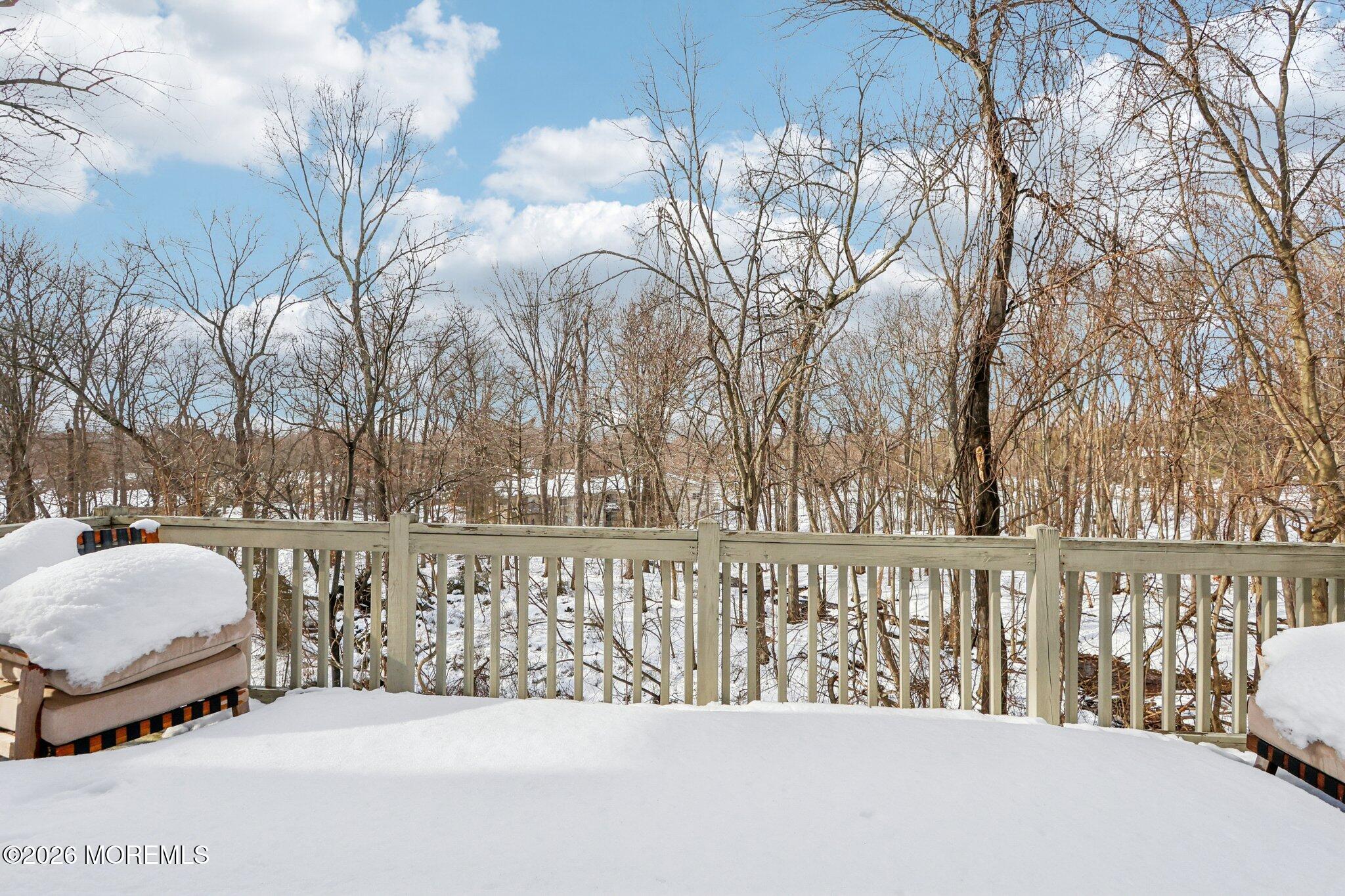 14 West Aspen Way Matawan, NJ 07747 - Photo 37 of 42 a view of roof with a bench and trees