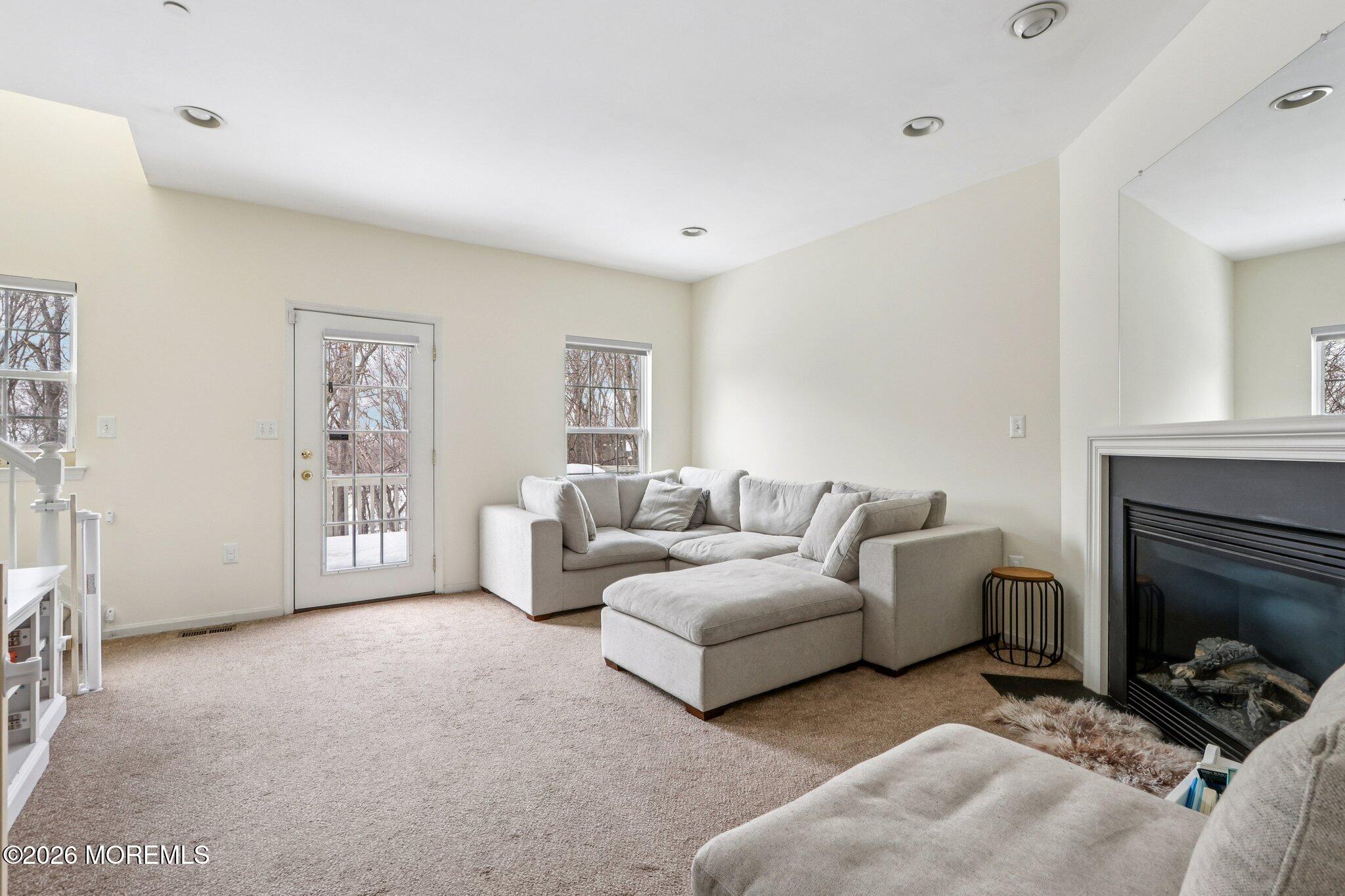 14 West Aspen Way Matawan, NJ 07747 - Photo 4 of 46 a living room with furniture and a fireplace