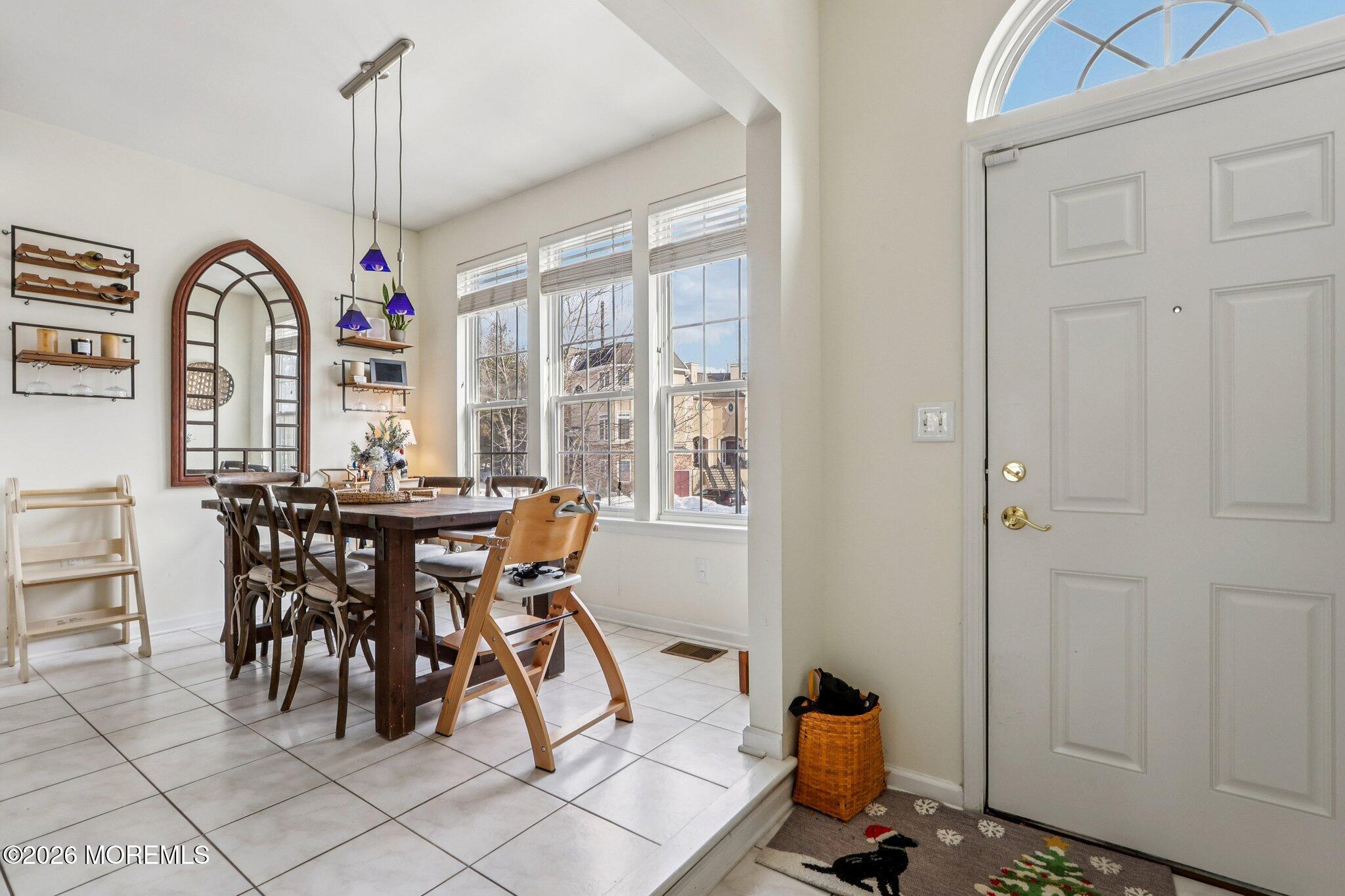 14 West Aspen Way Matawan, NJ 07747 - Photo 41 of 42 a view of a dining room with furniture window and outside view