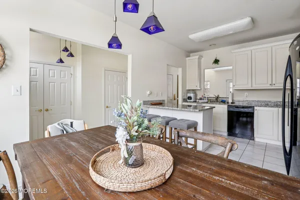 a kitchen with stainless steel appliances a refrigerator and a stove top oven