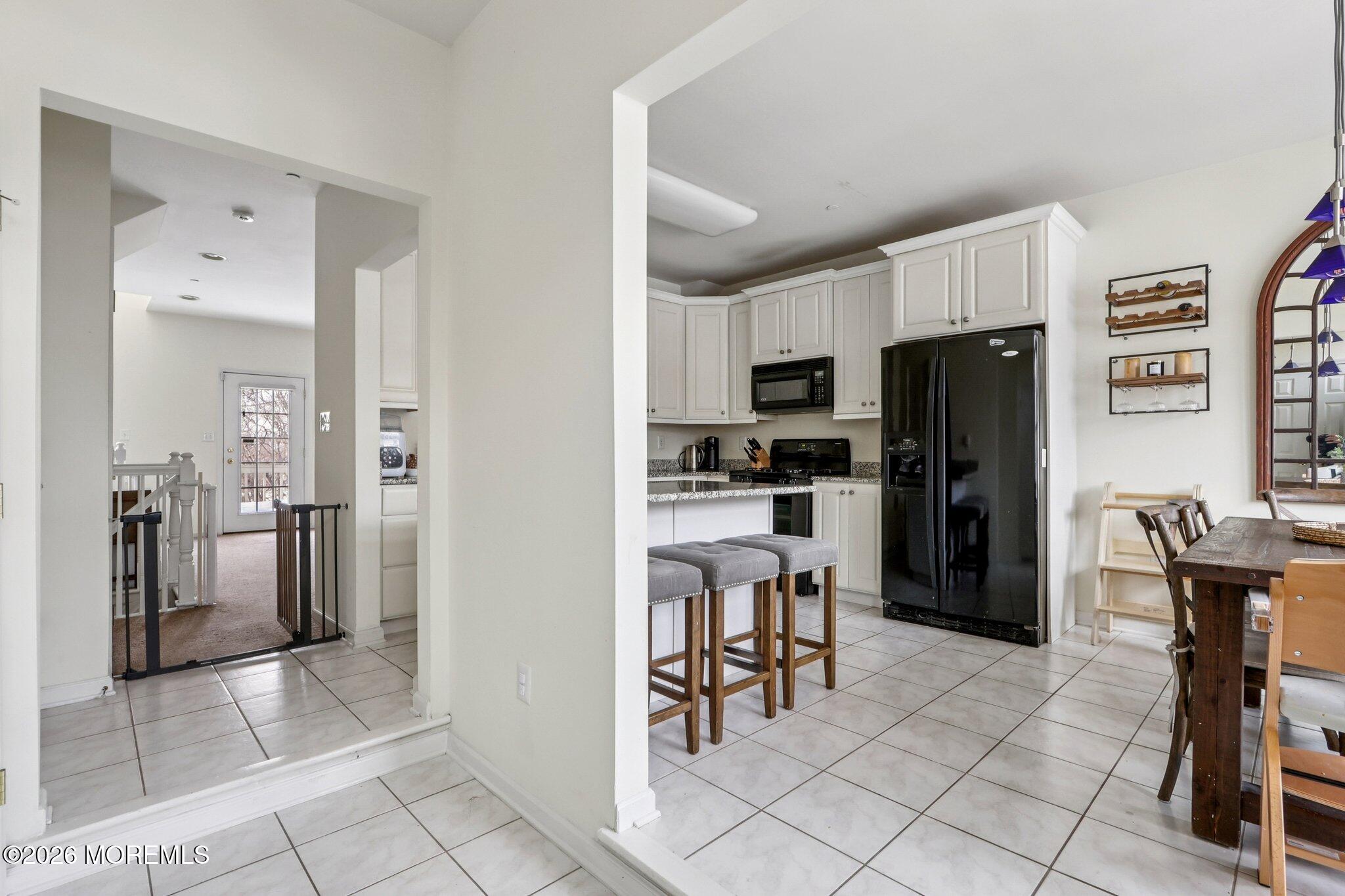 14 West Aspen Way Matawan, NJ 07747 - Photo 6 of 42 a kitchen with stainless steel appliances a refrigerator and a stove top oven