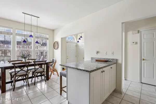 a kitchen with stainless steel appliances granite countertop a stove top oven a sink a counter space and cabinets