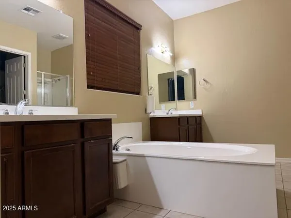 a view of a dining room with furniture and a chandelier