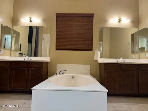 a white toilet sitting next to a shower curtain