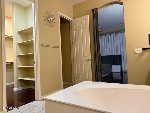 a bedroom with a bed and a table