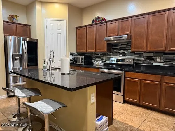 a bathroom with a shower and a sink