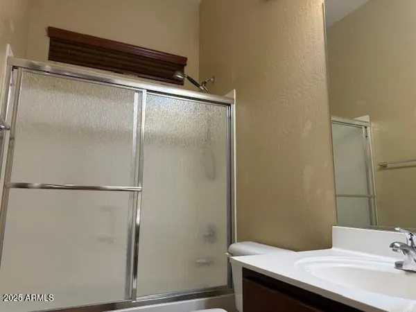 a view of swimming pool with seating space