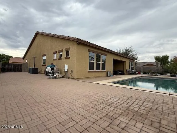 a view of a swimming pool with a patio