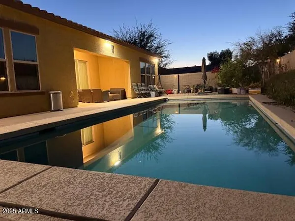 a view of a chairs and table in the patio