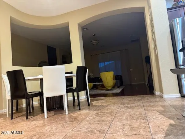 a view of a livingroom with furniture and a flat screen tv