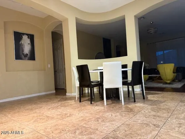 a kitchen with stainless steel appliances granite countertop a refrigerator a stove and a sink with wooden cabinets