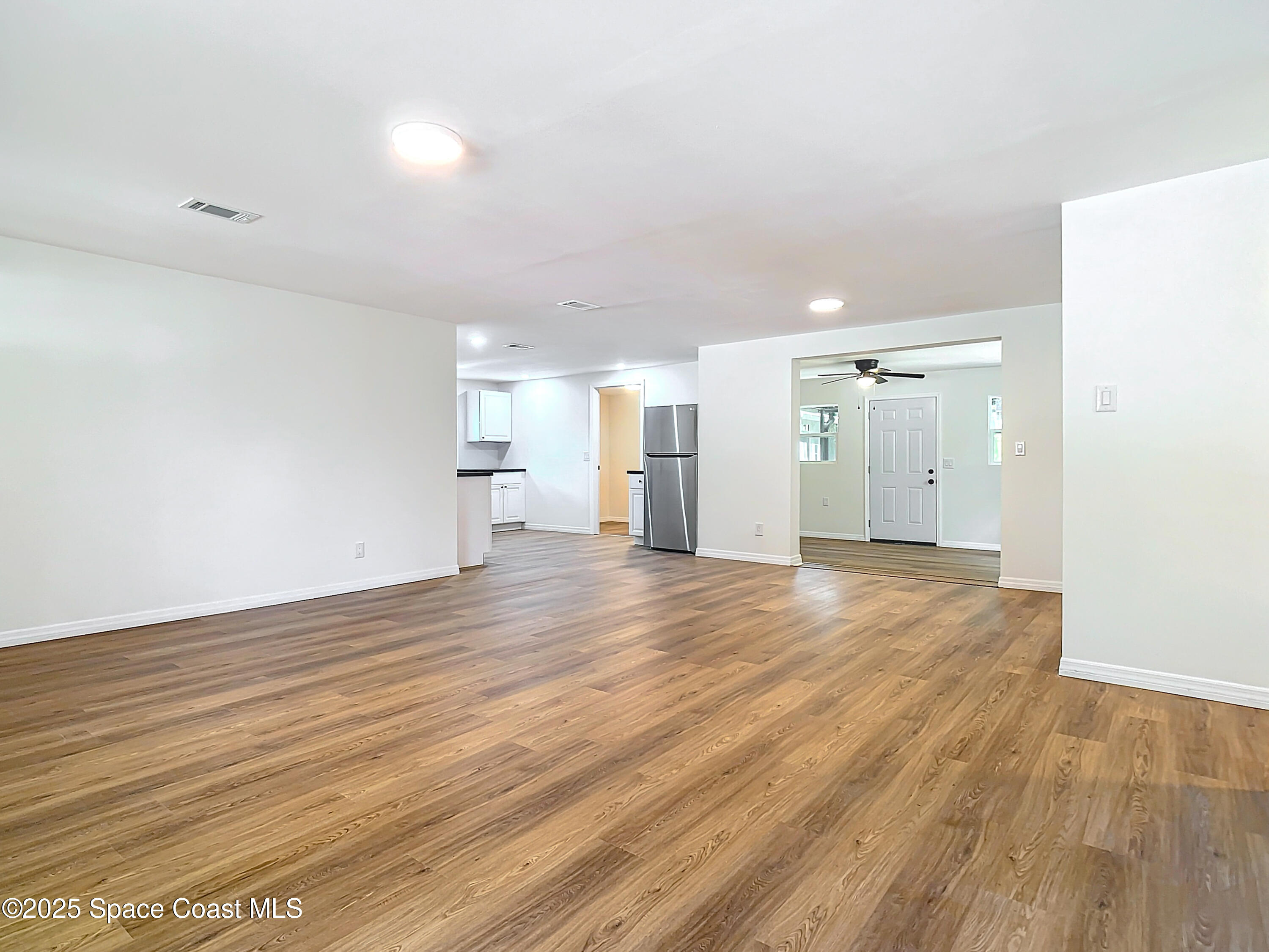 392 Arora Boulevard Orange Park, FL 32073 - Photo 12 of 45 a view of empty room with wooden floor