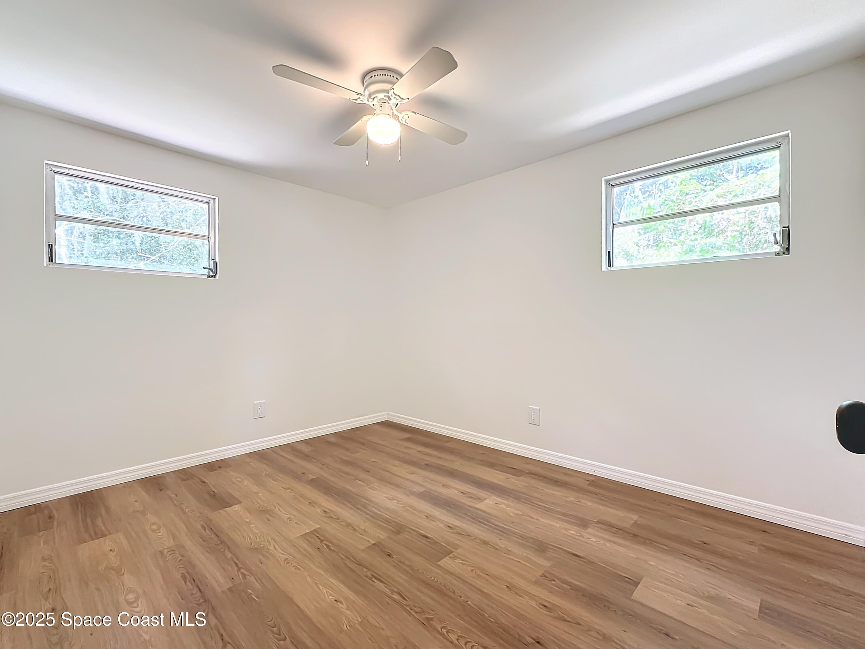392 Arora Boulevard Orange Park, FL 32073 - Photo 20 of 45 a view of an empty room with wooden floor