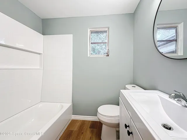 a bathroom with a sink toilet and a bathtub