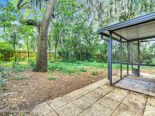 a view of a barn with a backyard
