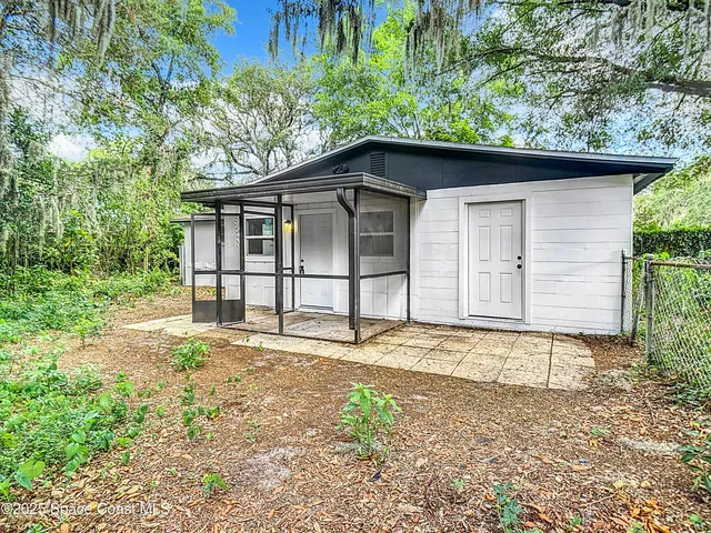 a house with a tree in the background