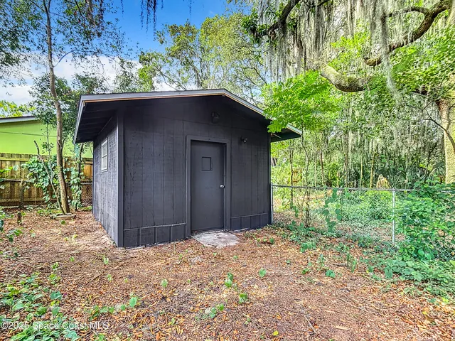 a house with a tree in the background