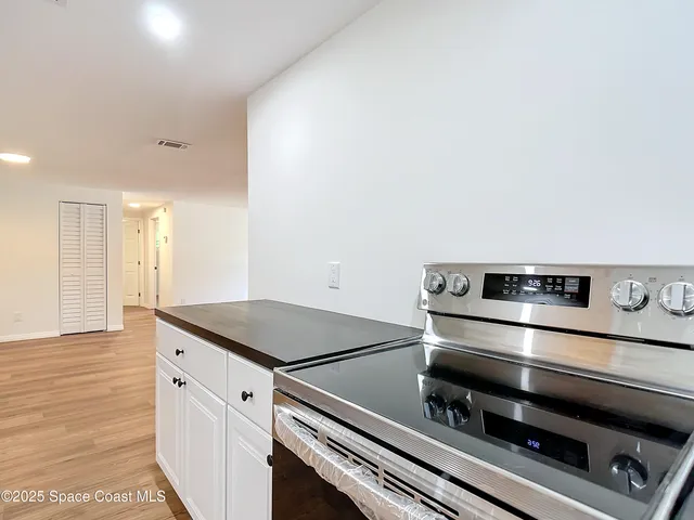 a kitchen with a stove and a microwave