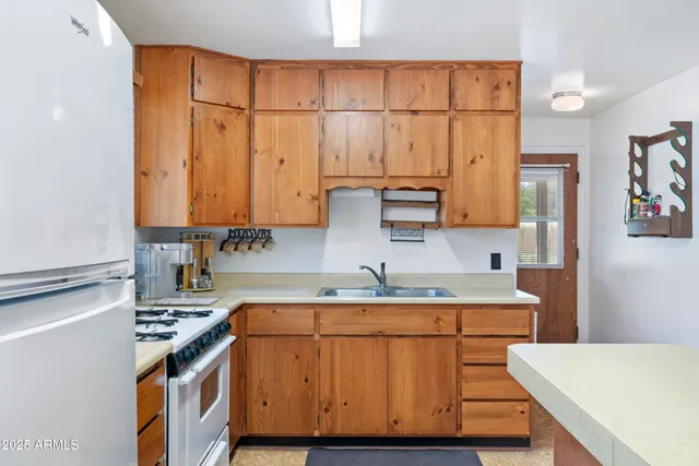 a kitchen with a stove and a sink
