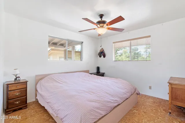 a bathroom with a sink a toilet and shower curtain