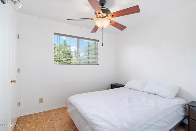 a bedroom with a bed and a closet