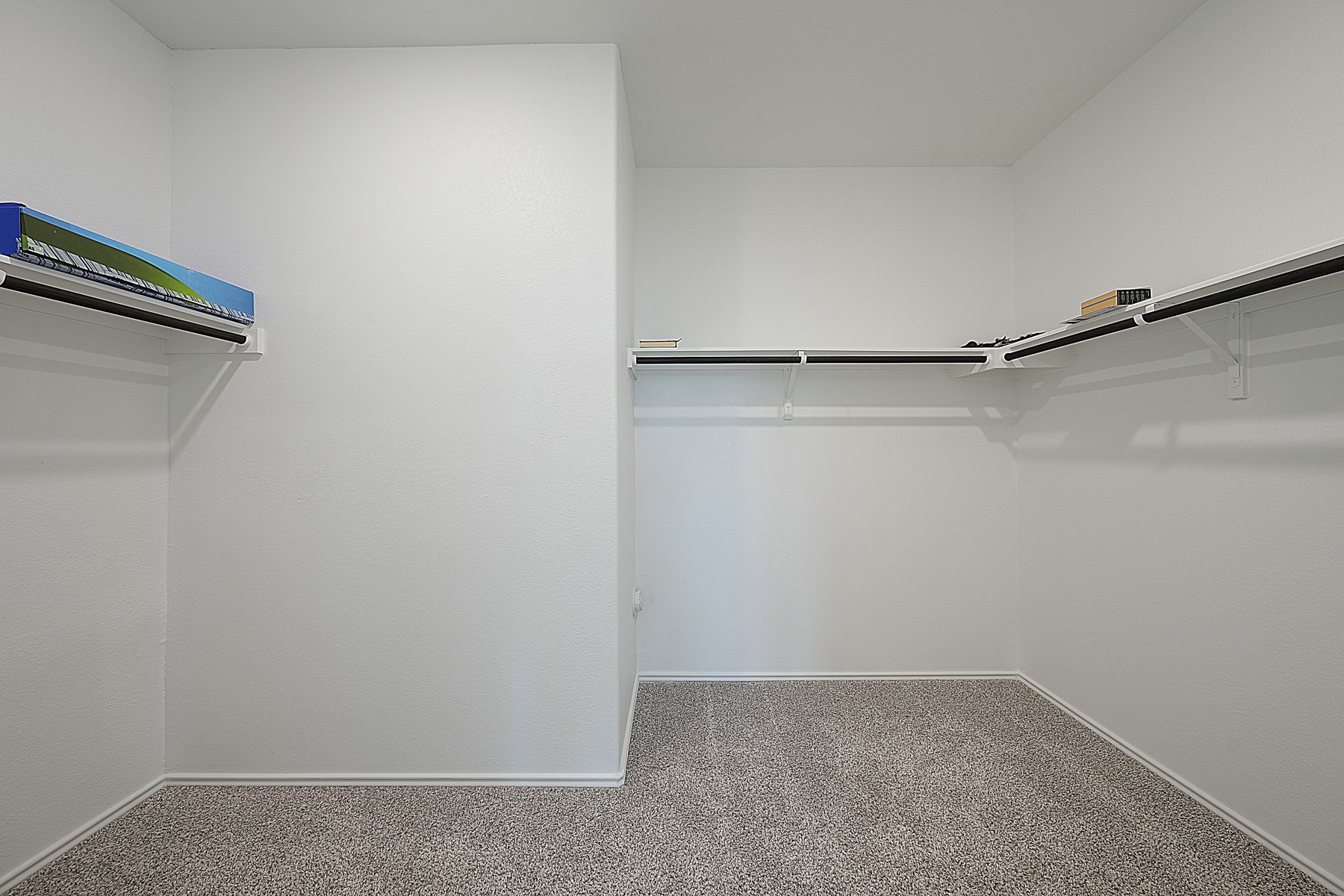 932 Mallow Road Leander, TX 78641 - Photo 18 of 34 Ample shelving and hanging space defines this functional walk-in wardrobe.