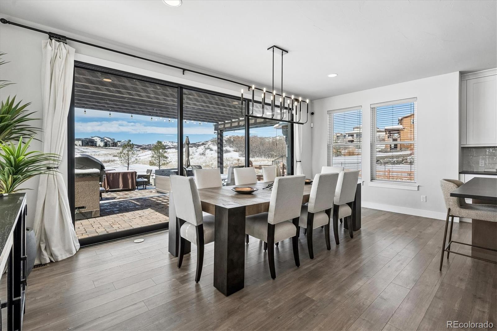 5601 Raintree Drive Parker, CO 80134 - Photo 6 of 50 a view of a dining room with furniture window and wooden floor