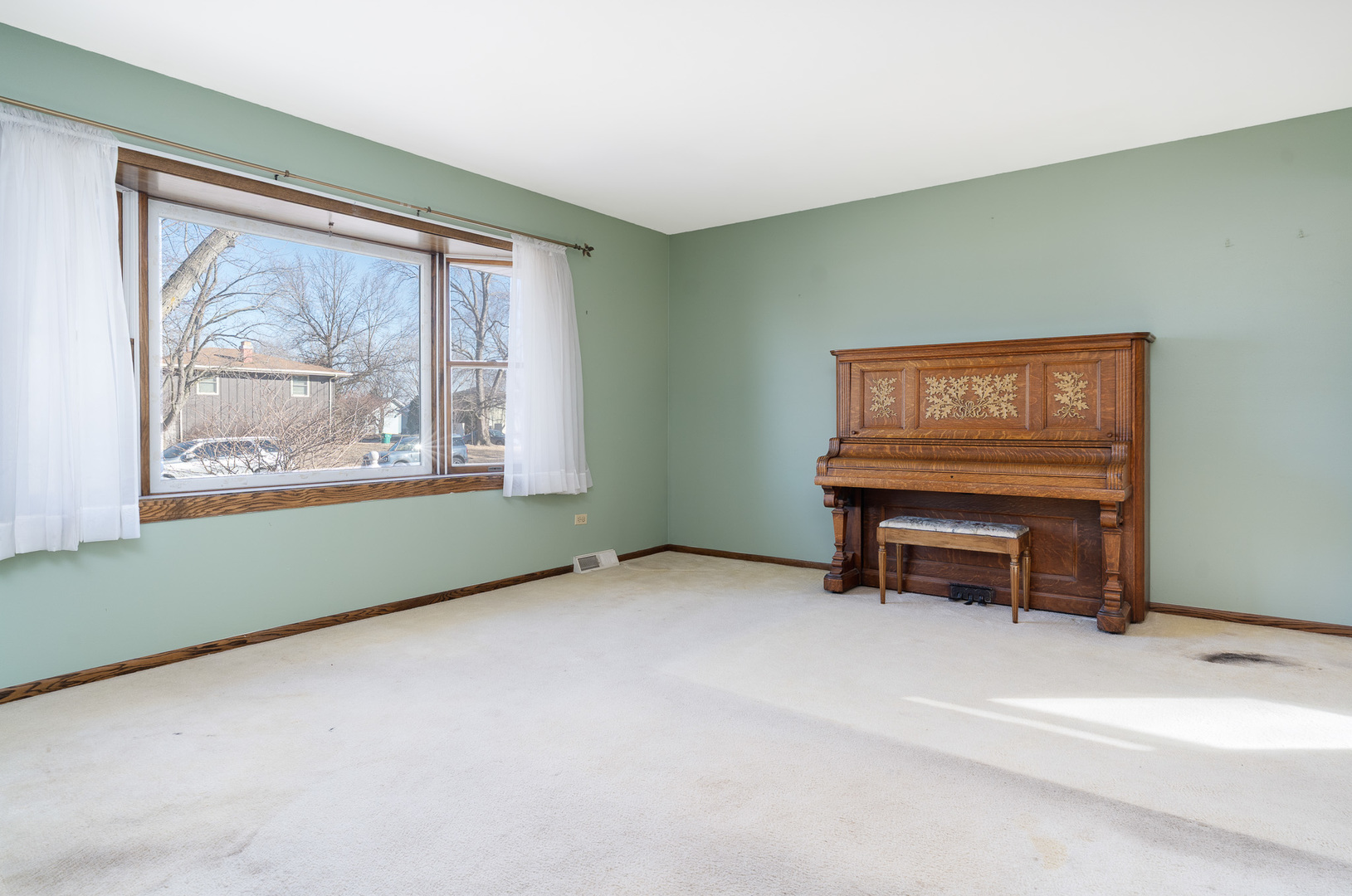 1327 Timberline Drive Joliet, IL 60431 - Photo 9 of 35 a view of an empty room with furniture a ceiling fan and a window