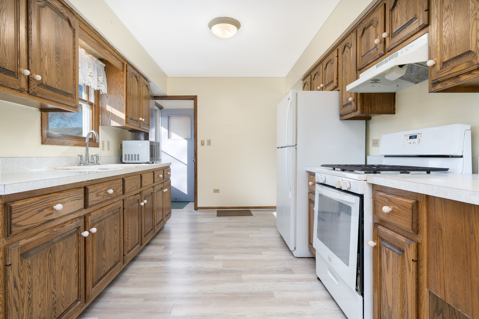 1327 Timberline Drive Joliet, IL 60431 - Photo 10 of 35 a kitchen with stainless steel appliances granite countertop a sink and a stove