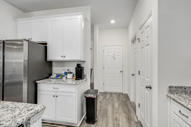 a kitchen with a sink stove and refrigerator