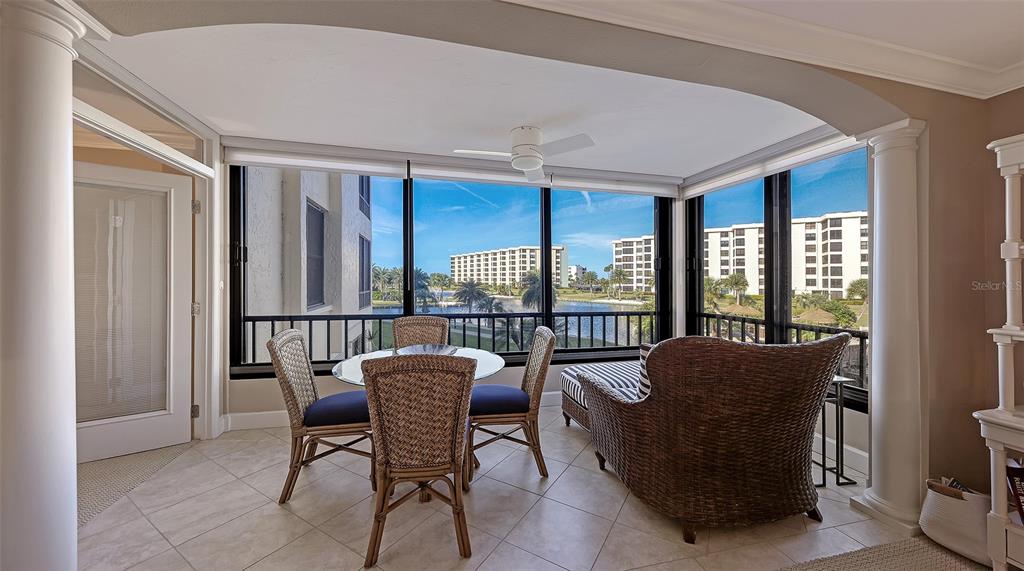5780 Midnight Pass Road, Unit 207 Sarasota, FL 34242 - Photo 8 of 35 a living room with furniture and a window