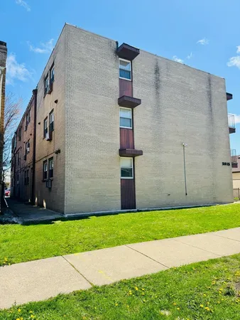a view of a building with a yard
