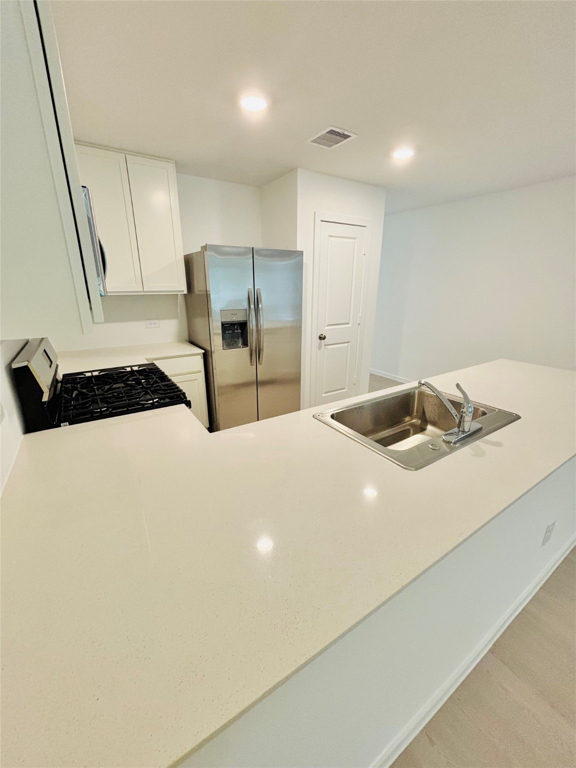 1747 West Stroker Road Crosby, TX 77532 - Photo 11 of 42 Nice white and clean quart countertop