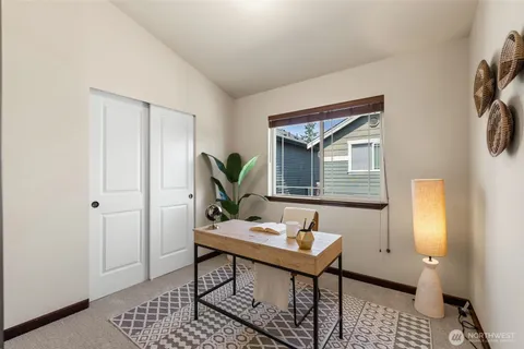 a view of a livingroom with furniture and window