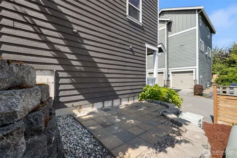 a backyard of a house with outdoor seating