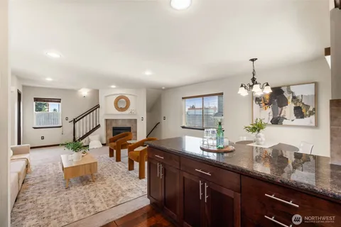 a kitchen with stainless steel appliances granite countertop a sink stove and cabinets