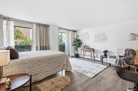 a living room with furniture rug and window